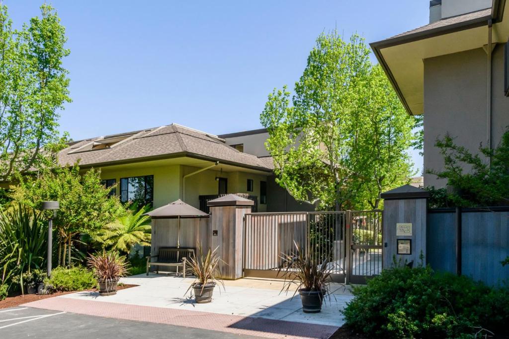sought after stretch unit at Menlo Commons located on the first floor-updated and move in ready-open plan living room, dining area, and kitchen each painted in a different color-beautiful engineered wood flooring throughout the unit-for the cook, a well equipped kitchen updated with stainless steel appliances, recessed lighting, granite countertops, ample cabinetry-primary bedroom has separate sitting area or small desk area- large walk-in closet with built-in cabinetry-ensuite bathroom includes new walk-in shower and laundry closet-enjoy views of trees and million dollar homes from the balcony off living room on a sunny afternoon-second bedroom shares balcony and is connected to a second updated bathroom with extra closet space and full size washer/dryer-living room and bedroom are virtual photos-active 55+ community offers: pool/spa heated year round, resident lounge and full kitchen, exercise room-complex is near Stanford University, Stanford Hospital, Stanford and Sharon Heights Shopping Centers-easy access to I-280