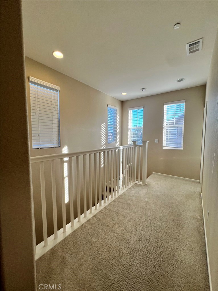 Beautiful detached home in the desirable Pavilion Park community of Irvine. Built in 2014, this residence offers approximately 2,011 sq. ft. of living space with 4 bedrooms and 3 full bathrooms. The open floor plan features a spacious great room and an expanded kitchen with a large island, stainless steel appliances, and abundant cabinetry. Tile flooring in high traffic areas with carpeted bedrooms upstairs. The primary suite includes a soaking tub, separate shower, and walk-in closet. Additional highlights include an upstairs laundry room, attached 2-car garage, and energy-efficient solar system.
Community amenities include clubhouse, greenhouse, junior Olympic pool, sports courts, playgrounds, and BBQ areas. Convenient location near Woodbury Town Center, Irvine Spectrum, and major freeways. Served by award-winning Irvine Unified School District.