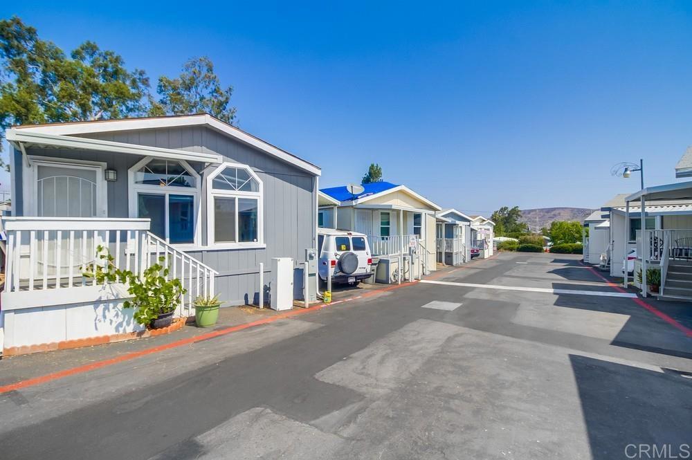 Welcome home to this beautiful 2-bedroom, 2-bath home in the heart of Santee, offering the perfect blend of comfort, space, and value. The spacious layout features a primary suite with an attached bathroom and a private door leading to the backyard, creating a peaceful retreat and seamless indoor-outdoor living. The generous backyard is one of the largest in the park, perfect for relaxing, gardening, or entertaining. Whether you're a first-time homebuyer, downsizing, or seeking an affordable living option, this home offers a comfortable and budget-friendly solution. Located in a quiet, well-maintained all-ages park above Mission Gorge Road, this home offers easy access to shopping, dining, public transportation, and major freeways, providing the ideal balance of tranquility and convenience. Community amenities include a sparkling pool, dog park, and on-site laundry facilities. With a low monthly space rent of just $965, this is a rare opportunity to own in one of Santee’s most desirable locations. Don’t miss your chance to call this home your own!