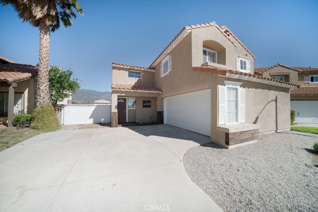 Charming Two-Story home with mountain views in the Heritage Community. Welcome to this beautifully maintained 3-bedroom, 2.5-bath home, offering 1,500 square feet of comfortable living space. Nestled in the sought-after Heritage community and within the desirable Etiwanda High School district, this home combines style, space, and convenience. Inside, the inviting open floor plan is enhanced by vaulted ceilings and an abundance of natural light. The spacious family room features a cozy fireplace, creating the perfect setting for relaxing evenings. The upgraded kitchen is a chef's delight, featuring granite countertops, a stainless steel sink, and stainless steel appliances with a bright breakfast nook ideal for casual dining. Upstairs, the master bedroom offers breathtaking mountain views, while the en-suite master bath boasts an oversized Roman tub for a relaxing retreat. Freshly painted interior & exterior, professionally cleaned interior. This home is ready to move in, all with charm, upgrades, and a prime location.