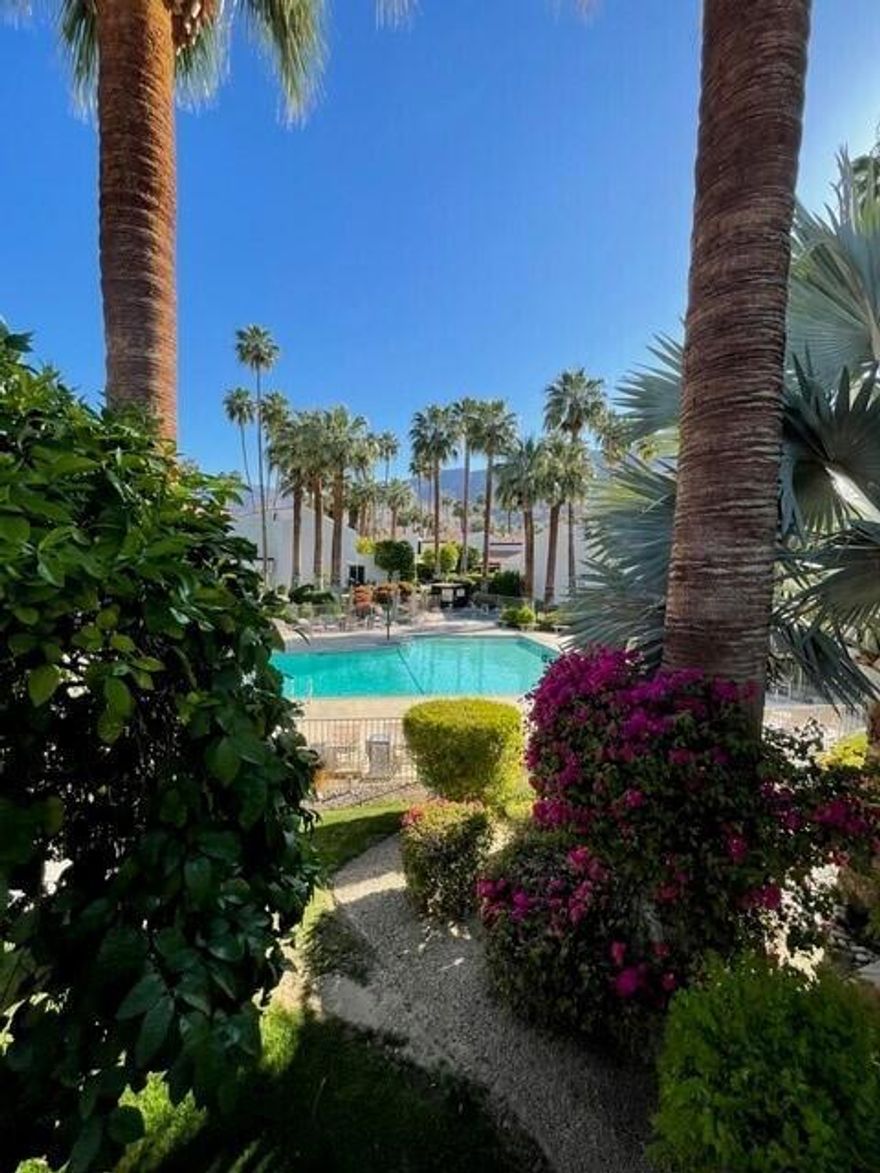 Experience the best location in Biltmore Phase I--this modern mid-century gem sits right next to the sparkling pool amid lush landscaping and stands out as one of the rare two-unit buildings in a community where most are four-plexes. This stylish and spacious two-bedroom, two-bath condo offers 1,054 sq ft of well-designed, multi-level living just moments from Palm Springs' best dining, shopping, and entertainment. Step into a beautifully updated interior featuring a modern kitchen complete with sleek black stainless steel appliances, quartz countertops, and a wine cooler--perfect for entertaining in style. The open layout, accented by contemporary finishes, creates a fresh, inviting vibe throughout. Added conveniences include an in-closet washer and dryer, and an attached one-car garage with private parking and extra storage. The spacious primary bedroom with an ensuite bath and private balcony showcases wonderful views. Whether you're gazing at the mountains or relaxing by the pool, this home offers the perfect backdrop for desert living. The resort-style community amenities include a sparkling pool and spa with a BBQ area, plus tennis and pickleball courts--everything you need to embrace the Palm Springs lifestyle.