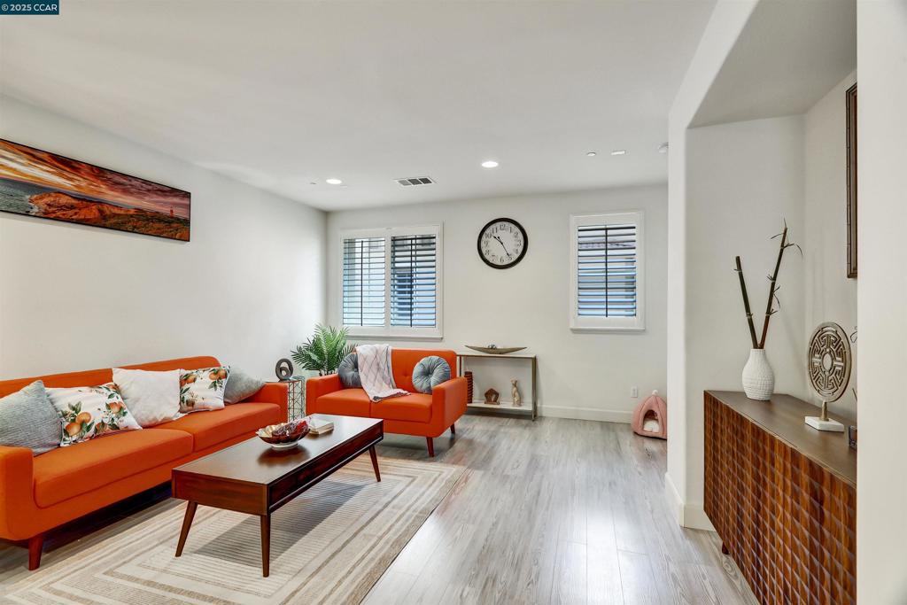 this exceptional townhouse offer 1,827 square feet, the residence features 3 spacious bedrooms and 2.5 elegantly appointed bathrooms. The first floor presents a flexible suite, ideal for guests, a home office, or multi-generational living. On the second level, an open-concept design seamlessly unites the kitchen, dining, and living areas. . Highlights include oversize counter top i, a generous pantry, and a convenient half bathroom—perfect for both everyday living and entertaining. Laminate flooring is installed in every room. enjoy unparalleled connectivity with easy access to highways 880, 580, 92, and 680, and within walking distance to the Part, Play ground, BART station, Amtrak, local shops, and dining options.