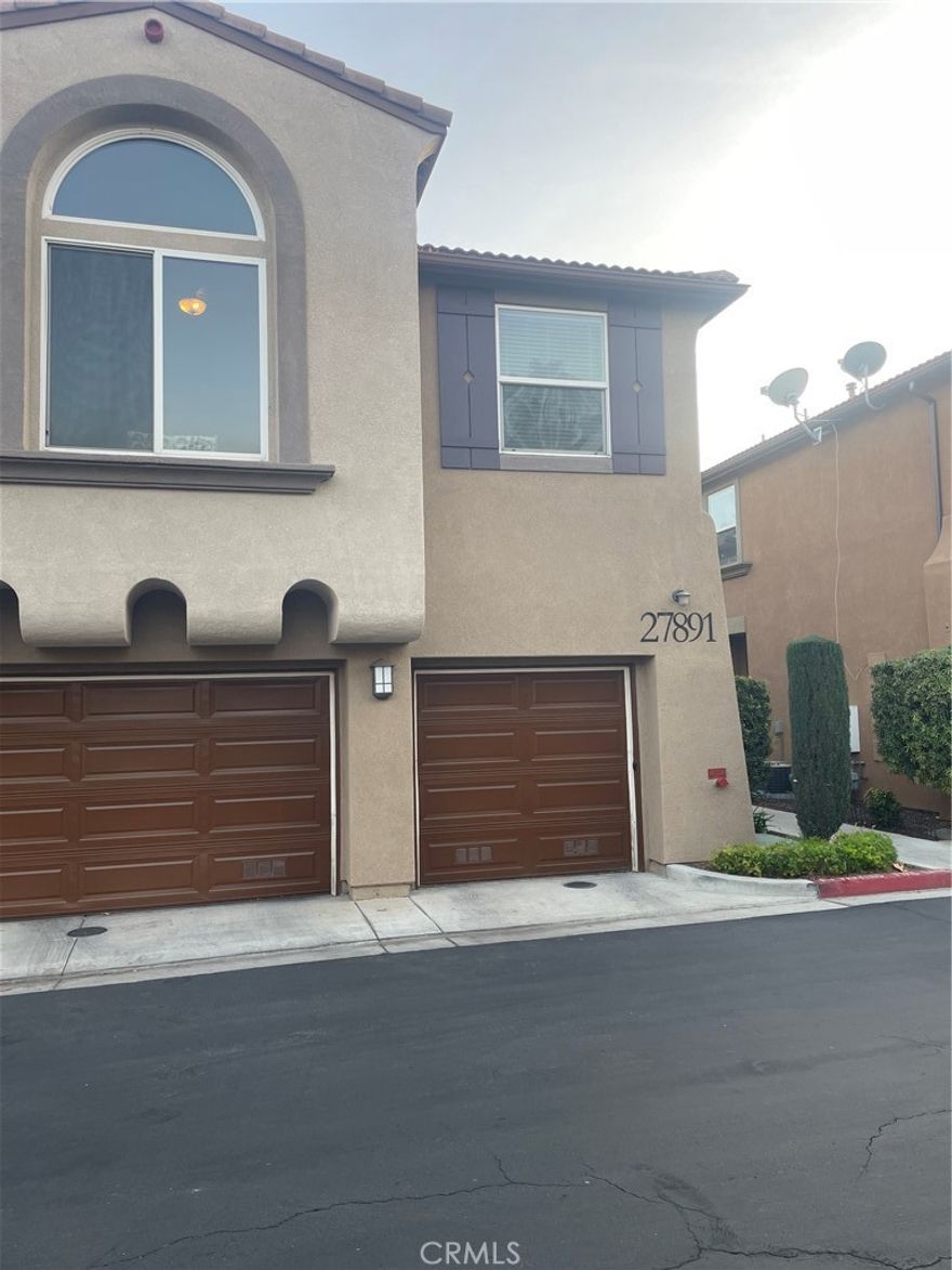 This charming 2-bedroom, 2-bathroom condo offers comfort and convenience with an attached 1-car garage, one extra parking spaces, in-unit laundry, and a modern kitchen featuring a large island, updated countertops, barstool seating, and stainless steel appliances. The open living and dining area includes a cozy fireplace, and a private balcony is perfect for relaxing or entertaining. The primary suite has a walk-in closet, while the second bedroom and bathroom feature stylish finishes. Residents enjoy access to a community pool and spa, and the home is conveniently located near schools, shopping and hospitals.