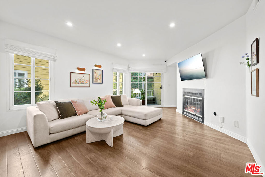 Welcome to Cambridge Glen! Tucked away in a picturesque Cape Cod-style community, this beautifully updated unit offers a bright and spacious open-concept living and dining area, complete with a cozy gas fireplace, recessed lighting, and direct access to a private patio. The remodeled kitchen features modern finishes, a convenient breakfast bar, and a pass-through that enhances the flow of the space.The primary suite includes a stylishly renovated en suite bathroom, while the generously sized guest bedroom is complemented by a remodeled guest bathroom. Additional highlights include a private garage with laminate flooring and a mezzanine level, providing excellent extra storage. Conveniently located with easy access to the Metrolink station, the 5 and 170 freeways, Burbank Airport, the NoHo Arts District, and Universal Studios.