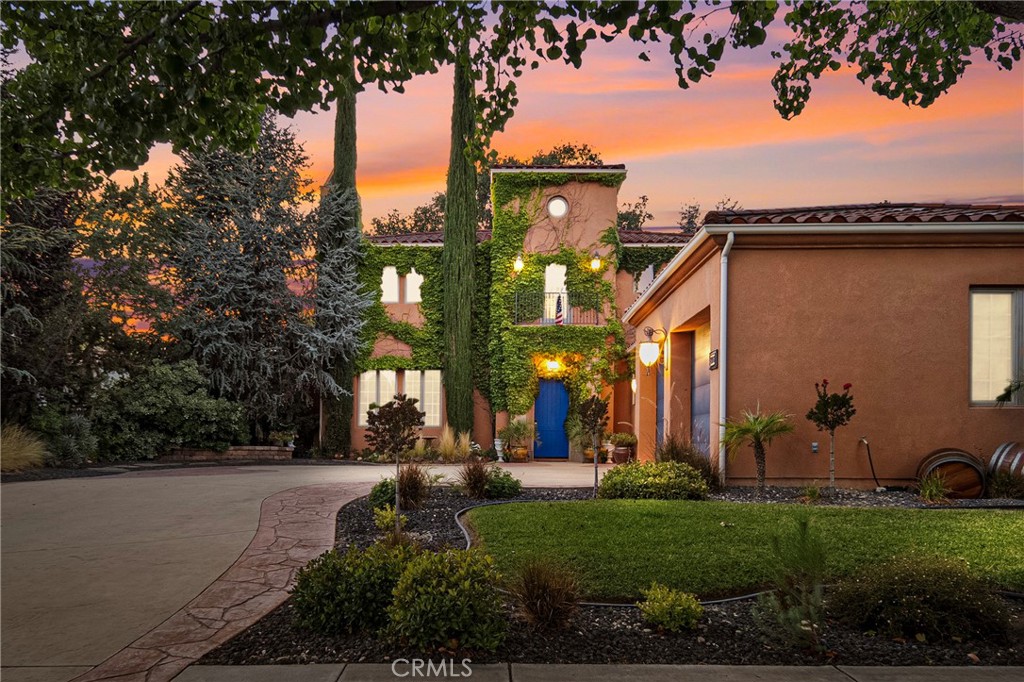 Introducing “Tuscan Beauty” — a Tuscan-inspired retreat nestled in the prestigious Del Oro neighborhood of Paso Robles. With over 3,300 square feet of timeless design and refined living space, this two-story estate offers the perfect blend of elegance, comfort, and everyday functionality.
From the moment you step through the grand entryway, you’re welcomed by soaring ceilings, natural light, and a sense of warmth that carries throughout the home. Rich wooden ceiling beams and a striking stone fireplace anchor the expansive living room, creating a warm and inviting atmosphere for both relaxing nights in and memorable gatherings.
At the heart of the home is a thoughtfully designed kitchen, featuring hardwood flooring, a luxurious copper sink, custom glass-front cabinetry, an island with a secondary prep sink, and a stylish backsplash. Whether you’re hosting guests or enjoying a quiet morning coffee, the kitchen flows beautifully into the home’s open layout.
The main-level primary suite is a true retreat — complete with its own fireplace, peaceful views of the backyard and pool, and direct access to outdoor living. The ensuite bath is spa-inspired, offering a soaking tub, separate shower, bidet, and heated toilet. A custom-designed walk-in closet with dual access from both the bedroom and bathroom adds a layer of luxury and practicality.
Upstairs, you’ll find three spacious bedrooms, a shared full bath, and a versatile flex space perfect for a media lounge or an additional living space.
Outside, the backyard is your own private oasis. Lounge by the pool, enjoy sunny afternoons under the covered patio, or entertain family and friends. The spacious driveway offers ample room for RV or oversized vehicle parking, while the attached three-car garage adds convenience and storage flexibility.
Additional features include 6-inch soundproof walls for enhanced privacy, elegant French windows on the lower level, a dedicated laundry room, and a quiet office area for remote work or study.
Ideally located with easy access to Highway 46, you're just minutes from world-renowned wineries, local shopping, and Paso Robles High School.
With its blend of luxurious finishes, thoughtful design, and prime Paso Robles location, “Tuscan Beauty” offers a rare opportunity to experience elevated living in one of Paso Robles’ most desirable neighborhoods.