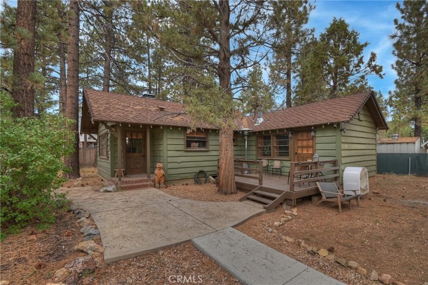 This cozy 2-bedroom, 1-bath cabin offers 932 sq. ft. of living space on a generous 10,425 sq. ft. lot (including adjacent lot) — providing plenty of room to expand or enjoy extra outdoor space. Step inside to a warm and inviting interior featuring a beautiful stone fireplace, perfect for creating that classic mountain ambiance!

Relax and unwind in your private Jacuzzi, surrounded by the tranquility of the mountains. Conveniently located just 10 minutes from Big Bear Lake, close to the Village for shopping and dining, and only minutes from popular ski resorts, this home is perfect for year-round living, a vacation getaway, or a short-term rental investment.

Don’t miss this rare opportunity to own a cabin with a spacious lot in one of Big Bear’s most desirable locations!