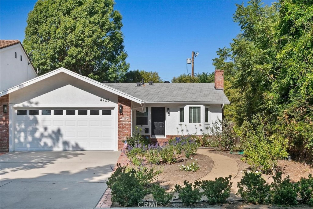 Welcome to your Sherman Oaks sanctuary, moments from Ventura Boulevard’s dining, entertainment, shops, the Galleria, and parks; with award-winning school systems; beautifully renovated and move-in ready.
This 3-bedroom, 2-bath home blends style, comfort, and open-concept design, centered around a beautiful marble fireplace. The updated kitchen with quartz counters and stainless appliances connects seamlessly to the dining and living spaces, and through French doors opens to a patio overlooking fruit trees and flowers—perfect for everyday living and entertaining.
French doors from the primary suite open to a private backyard retreat, where mature trees, fruit trees, and flowers surround a peaceful patio—an ideal setting for morning coffee, weekend barbecues, or entertaining friends.
Both bathrooms have been thoughtfully remodeled with dual vanities and high-end finishes.
Other practical touches include a spacious attached 2-car garage with epoxy floors and generous storage, a brand-new central heating and cooling system (HVAC), controllable recessed lighting, water-conserving irrigation and landscaping that enhance the home’s curb appeal and a beautifully painted interior and exterior