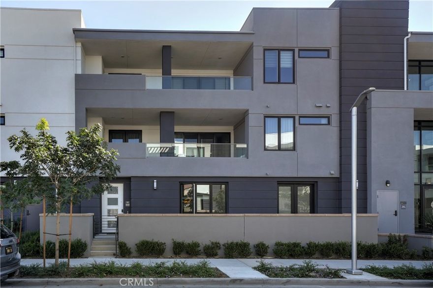 Welcome to The Landing at Tustin Legacy — a highly sought-after luxury condo community in the heart of Orange County. This move-in-ready residence is thoughtfully designed for effortless single-level living, offering 2 bedrooms, a den, 2 bathrooms, and a private oversized 2-car garage — all within a secured building featuring a welcoming lobby and convenient elevator access.

Step inside to a bright, open-concept living space that flows seamlessly from the formal dining area to the gourmet kitchen. The oversized island is perfect for meal prep, serving, and bar seating for four. The kitchen showcases quartz countertops, an upgraded backsplash, sleek white cabinetry accented with satin nickel hardware, and glass-front cabinet doors — ideal for displaying your favorite dishware or collectibles. Additional highlights include smart home technology, recessed lighting, paid-off solar, a hardwired alarm system, and timeless LVP flooring in a neutral designer shade chosen by the sellers.



Just off the family room, step onto an expansive covered patio deck (approx. 345 sq. ft.) — the perfect extension of your living space. Bathed in the gentle warmth of the morning sun, it’s an inviting spot to start your day with a cup of coffee or unwind in the evening. Both bedrooms are thoughtfully positioned in their own private wing, each with stylish modern bathrooms and walk-in closets. The primary suite features a spacious walk-in shower, while the versatile den offers the flexibility to serve as a third bedroom, home office, or creative space.

At The Landing, you’ll enjoy resort-style amenities including a sparkling pool, BBQ area, firepit, lounge spaces, tennis court, pickleball, sport court, and community gathering areas. Conveniently located near premier shopping, dining, and entertainment — with easy access to major freeways — you’re just minutes from Irvine Spectrum, South Coast Plaza, and Disneyland. Easy Access to 5, 55, 133, 241, 261 & 405.  Don’t miss your chance to experience modern luxury living at The Landing in Tustin Legacy — schedule your private showing today! (Click the 360 link for the full video tour.)