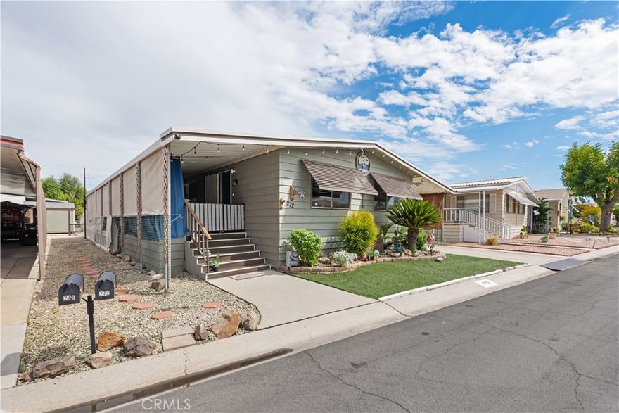 Located in a desirable 55+ senior community in the heart of Menifee, this spacious 2-bedroom, 2-bath home offers comfort, convenience, and modern upgrades throughout. Inside, you’ll find an inviting open floor plan with a separate living room, dining room, and family room, making it ideal for both entertaining and everyday living. The primary suite features a huge walk-in closet, while brand-new flooring enhances the beauty of the entire home.

This property is filled with upgrades, including a brand-new AC unit, new oven and gas stove, new dishwasher, garbage disposal, and water heater. The backyard is enclosed with a brand-new vinyl fence, and both the front and back yards feature fresh artificial grass for easy maintenance. Ceiling fans in every room provide year-round comfort, and a convenient ramp by the carport ensures easy access for those who may need it.

With very low space rent at just $695.27 per month, this home offers excellent value in a welcoming community. Buyers will need park approval, with an income requirement of three to four times the monthly rent. Priced right to sell, this home is a wonderful opportunity to enjoy affordable and comfortable living in a great Menifee location.
