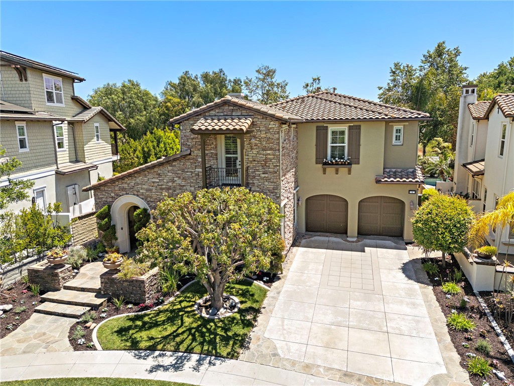 Seller Financing is an OPTION! Located near the end of one of the most beautiful cul-de-sacs in Ladera Ranch, this extraordinary Sherborne home at guard-gated Covenant Hills reveals an extensive selection of luxurious new upgrades and refinements. Manicured and mature landscaping elevate’s curb appeal and enhances richly detailed exterior architecture and updated custom hardscaping. A tandem three-car garage is recessed from the street, creating a long driveway with extra guest parking, and an arched gate opens to a private and peaceful stone-finished courtyard. Beyond a circular foyer, the large two-story design of approximately 4,328 square feet displays a stunning staircase, formal living room, and a formal dining room with patio. Five spacious bedrooms and four- and one-half baths include a main-level suite that is perfect for guests. Everyone will enjoy socializing and relaxing in a fireplace-warmed family room with custom built-ins and seamless access to a newly upgraded kitchen. Amateur or professional, chefs of all skill levels appreciate the beauty of new quartz countertops, a full tile backsplash and new Shaker cabinetry. An island and pantry are featured, and new stainless steel appliances include a six-burner cooktop with griddle, and a built-in Monogram refrigerator. New woodgrain luxury vinyl plank flooring and 10' ceilings enrich the first floor, newer designer carpet is displayed upstairs, and the entire home hosts fresh interior paint, newer exterior paint, new LED lighting throughout, mirrored wardrobe doors, a recent FULL REPIPE, and OWNED SOLAR power. Enjoy the flexibility of a bonus room and circular sitting area upstairs, and the charm of classic Juliet balconies in two bedrooms. The large primary suite is simply stunning, offering hill and open-space views, a walk-in closet, freshly painted cabinetry, and a remodeled bath with separate vanities, quartz countertops, a jetted tub, lux shower and access to a private view balcony. Gorgeous landscaping increases privacy in a tranquil backyard with two loggias, a custom built-in BBQ bar, pebble-finished patios, and lifelike synthetic turf. Covenant Hills’ private clubhouse and recreational attractions are close to home, and top schools, countless parks, miles of trails, and vibrant shopping centers are nearby. SELLER FINANCING is an Option!!