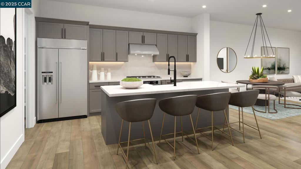 Connect with what matters most at Terraces at The Station, a new townhome community in Sunnyvale, the heart of Silicon Valley. Pack your bags, this home is move-in ready! A welcoming entry and Craftsman style staircase reveals the expansive main living level featuring a casual dining area and great room with access to a covered balcony. Kitchen is expertly crafted, with KitchenAid stainless steel appliances, large center island with accompanying breakfast bar, modern cabinets and quartz countertops. Primary bedroom suite is enhanced by dual closets a palatial primary bath complete with dual-sink vanity, large shower with seat. Stunning rooftop deck on the fourth floor, providing excellent entertaining opportunities. Additional highlights include easily accessible laundry on the bedroom level, a convenient powder room, additional storage, and 2-car finished garage with pre-wired 50 amps for electric car charging. Community clubhouse, indoor/outdoor lounge area, fireplace, bocce ball court, dog park, walking paths and expansive lawns. Terrace at the Station is located near Santana Row, Valley Fair Mall, Shopping Centers. Close to VTA Light Rail, Lawrence Caltrain and Bart. (photos not of actual home, for marketing only)