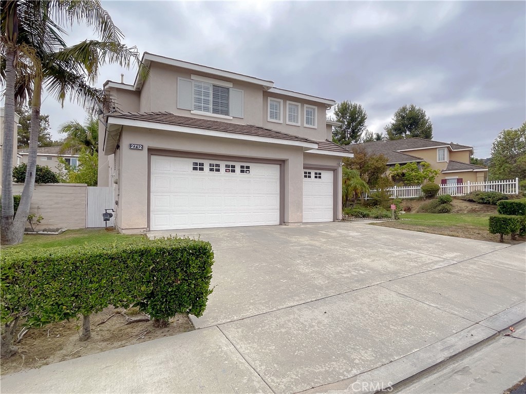 Beautiful 2-story single family residence, 4 Beds | 3.5 Baths | 3 Car garage (with Direct Access) | 2,922 sqft living | 7481 sqft lot | Build in 1994, located in the prestigious gated community of RIDGEMOOR, with attendant service at the main entrance.
The double-door front entrance leads to a high ceiling foyer, living room, and formal dining room, huge windows that allow lots of natural light. Gourmet kitchen features granite countertops, oversized center island, custom cabinets & appliances, and a cozy dining area. Kitchen also opens to a family/Great room with fireplace, and family/Great room door open to the backyard with lots of fruit trees, 1 bedroom suite downstairs is a plus, and individual laundry room has plenty of cabinets & shelving. The spiral staircase leads to the 2nd floor, where a spacious loft can easily be used as a lounge/reading area. The master suite features walk-in closets, his and hers vanities, a separate shower, and a soaking tub. A Jack and Jill bathroom is located between the 2 additional bedrooms.
Home is convenient to the shopping center, restaurants, parks, schools, and freeway.