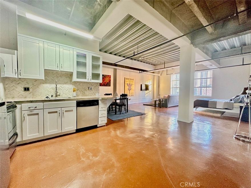 Modern open floor plan loft with fantastic urban industrial character on Broadway in the Historic Core. High concrete ceilings and large original window allow for great natural light. Polished concrete floors throughout and kitchen boasts solid wood cabinets, stainless steel appliances and granite counters. Bathroom has washer/dryer hookups in unit and oversized soaking tub. The loft faces Pershing Square and downtown skyline views. The best views in the building!  Situated just minutes walk  from The Bloc, Apple flagship store, Bottega Louie, Grand Central Market, Ralphs, Whole Foods, Staples Center/L.A. Live and the best dining and nightlife Downtown LA has to offer.  24-hr security, front desk concierge, fitness room, rooftop pool, hot tub and rooftop lounge area with amazing panoramic views of the Downtown Los Angeles skyline. Valet or self parking available onsite for $300/month per space. No pet restrictions.