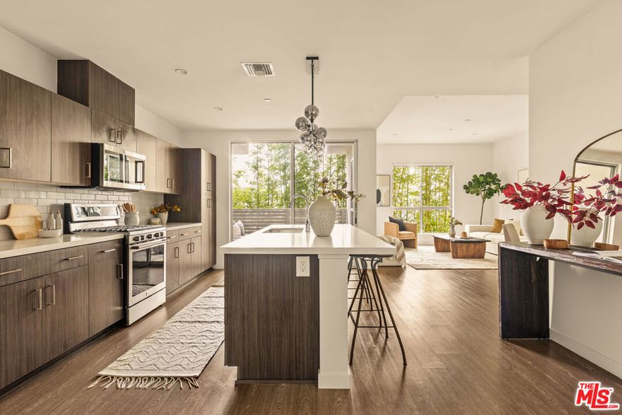 Welcome to a world of contemporary sophistication at X67 Lofts, one of Marina Del Rey's most sought-after modern communities. This third-floor corner residence is quietly tucked at the back of the building, offering rare privacy while being just down the hall from the pool, fitness center, and community room. Designed for both comfort and style, the spacious two-bedroom, three-bath floor plan blends urban design with coastal ease, accentuated by soaring ceilings, expansive windows, and open-concept living bathed in natural light. The chef-inspired kitchen anchors the home with European cabinetry, quartz countertops, a large center island, and stainless-steel appliances perfect for both entertaining and everyday living. Two private patios invite seamless indoor-outdoor flow, ideal for morning coffee or sunset relaxation. Retreat to the primary suite, complete with its own patio, a generous walk-in closet, and a spa-like ensuite bath featuring dual vanities and a sleek, frameless glass shower. The second bedroom and bath offer versatility for guests or a stylish home office. At X67 Lofts, residents enjoy an array of upscale amenities: concierge service, furnished lobby with coffee bar, fitness center, pool and sun deck, resident lounge, EV charging stations, and beautifully landscaped courtyards with BBQ areas. Two secured parking spaces, guest parking, and included DirecTV and high-speed internet complete this exceptional offering. Located in the heart of the Marina Arts District, you'll never need to get in your car movie theaters, restaurants, bars, Equinox, and grocery stores are all just outside your door. With beaches, shops, and the vibrant Venice and Abbot Kinney scenes nearby, and easy access to LAX and coastal bike paths, this is modern coastal living at its most effortless.
