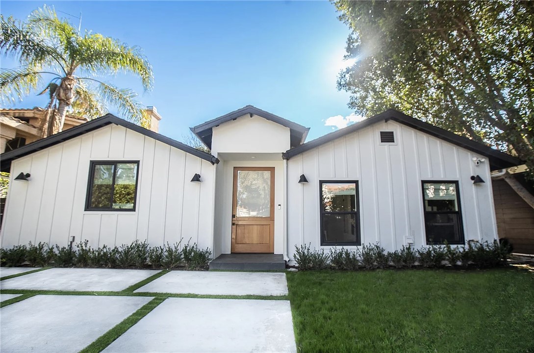 FULLY FURNISHED & EQUIPPED OPTION AVAILABLE (with current pictured furniture).
Completely redesigned California modern farmhouse located on a very desirable tree-lined street within the heart of Sherman Oaks. This single-story 5BD/4BA (inclusive of attached ADU) home 2814 sf with no detail spared. The attached ADU has a beautiful kitchen with a full sized fridge, cook top and wine fridge....perfect for any workspace, office, or bedroom. White oak hardwood flooring and clean lines grace the interior as you enter the open-concept floor plan. The chef's kitchen is equipped with top-of-the-line Jenn-Air appliances with an abundance of cabinetry and counter space w/ porcelain center island that opens to the dining and living room. The living room features high ceilings endless skylights and large pocket glass sliding doors opening to the resort-like backyard, epitomizing the California indoor/outdoor lifestyle. The primary suite is its own sanctuary with an extra large walk in closet. The primary spa-like bath has a freestanding soaking tub in the oversized shower. The other four bedrooms are generously sized, and have ample closet space. Ideal for entertaining, the backyard offers a patio, fire pit, pool, spa, built-in barbecue and plenty of grass for friends and family to enjoy. Both the pool and spa are heated. There are Sonos speakers throughout the house and the light switches are smart lights already set and programmed to work with Alexa. Entire house was designed by owner and features fixtures / hardware from Restoration Hardware, Rejuvenation, Zia Tile, Schoolhouse Electric, and more. Home is also equipped with a Tesla charger. Just a short drive to Westfield Fashion Square and all the dining and shopping on Ventura Blvd, as well as easy access to freeways, this home is truly a must-see. We love pets, lets just discuss first!
Lease can be flexible.
Open to long or short term.
Available August 3rd