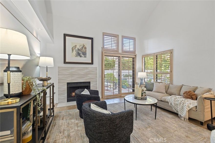 Welcome to 83 Briarglen, located in the highly desirable Woodbridge community of Irvine. Master Suite on the main level. This beautifully upgraded end unit townhome offers 2 bedrooms plus an office which can used for a 3rd bedroom and 2 full bathrooms, including a convenient main-floor bedroom and full bath. Flooded with natural light, this end unit features an open-concept floor plan with built-ins, numerous windows, vaulted ceilings, and a cozy fireplace that creates a warm and inviting atmosphere. The sliding door opens to a spacious private patio, providing a serene outdoor retreat perfect for entertaining or relaxing. The updated kitchen offers edge grain butcher block countertops, stainless steel appliances, an apron farmhouse sink, and ample linear design cabinetry. The in-unit laundry room is conveniently located just off the kitchen. Upstairs, the spacious primary suite offers privacy and comfort, while an enclosed loft area provides a versatile space ideal for a home office, guest room, or den. Additional highlights include wide plank engineered hardwood floors throughout, including the stairs, recessed lighting, and a detached, enclosed one car garage. Located just steps from Briarglen Park, offering a swimming pool, spa, volleyball court, and large grassy areas perfect for outdoor fun. Enjoy the exceptional amenities of the Woodbridge community, including lakes, Lagoons, additional pools, spas, tennis courts, and parks.  Situated in the award-winning Irvine Unified School District. World-class shopping, dining, and easy freeway access complete this fantastic opportunity. Schedule your private showing today.