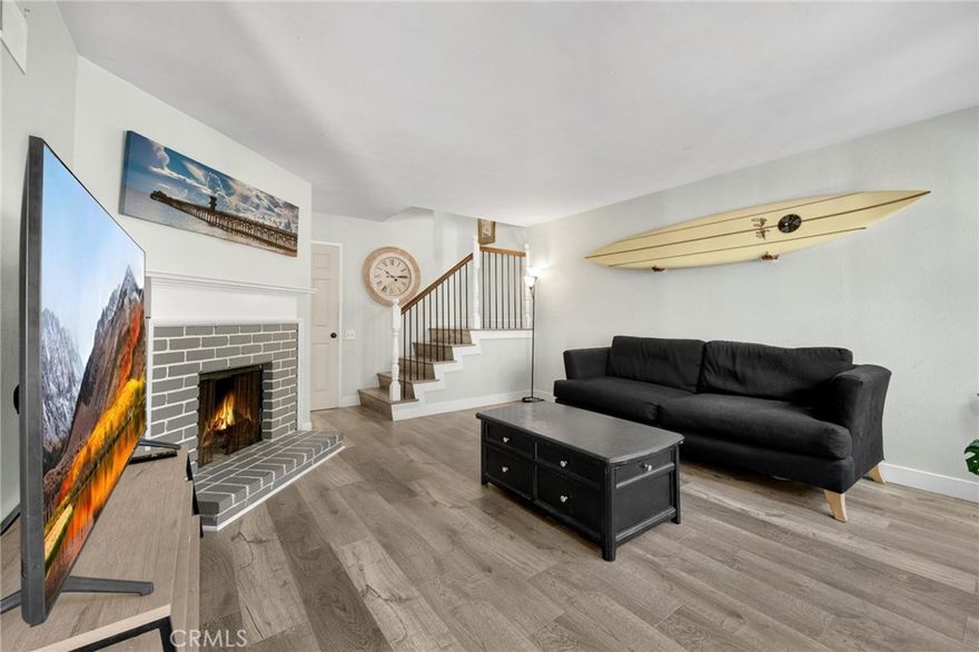 Beautiful townhouse just minutes from the beach. This stylish 2-bedroom is located in a gated community and has a fresh, clean feel with all new flooring throughout, "London Laminate Flooring Micro V-Bevel single click" to include flush stair noise. The light and bright kitchen has recessed lighting, granite countertops, and stainless steel appliances plus matching granite in the bathrooms.

The primary bedroom is super roomy with two closets with built-ins, separate vanity area with sink, and even has a extra nook that's great for a small office, workout spot, or extra storage.  Additional highlights include ceiling fans in both rooms, convenient 1/2-bath downstairs, two brand new toilets by "Glacier Bay", an inside laundry, attached garage, upgraded stair railing, large private patio with slider off kitchen/dining area, and a well-maintained community setting.

Move-in ready and close to the coastal breezes, shopping dining, and more - this is a great spot to call home!