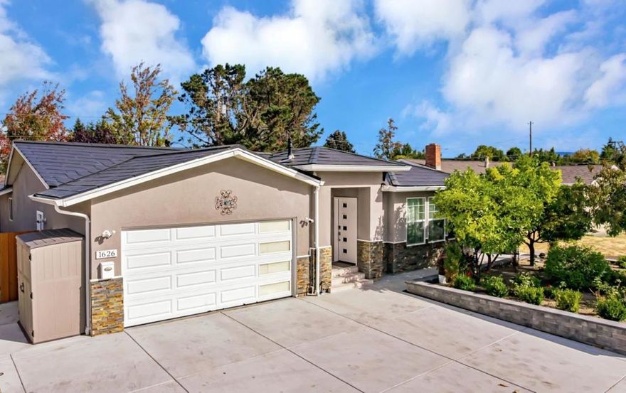 This beautiful turnkey 4BR/3BA single level home spans approx. 1,923 sq ft and offers the perfect balance of style, comfort and convenience - giving you peace of mind with no major projects needed!  High ceilings, abundant windows and skylights fill the open room layout with natural light creating a bright, welcoming space. The home was transpired, and additional living space was created in 2019. The complete renovation introduced new:  flooring/windows throughout, a stylish kitchen with stainless mosaic tile and granite counters, spa-inspired bathrooms and HVAC system. Recently, the home has again been elevated with a Tesla Solar Roof (owned!), power wall and vehicle charging station, main panel upgrade, Samsung kitchen appliances, Indow window inserts, whole-house water softener, 3 phase water purifier, hardscaping creating usable/low maintenance space and a dry sauna to pamper yourself - making this home as luxurious as it is functional. Two ensuite bedrooms provide privacy for you and your guests. Nestled in one of the most central commute locations of Silicon Valley, you are a few-minute walk to Apple, minutes to Nvidia and access to Silicon Valley's tech corridor. Located near highly rated schools, restaurants and shopping, you are going to love calling this home!