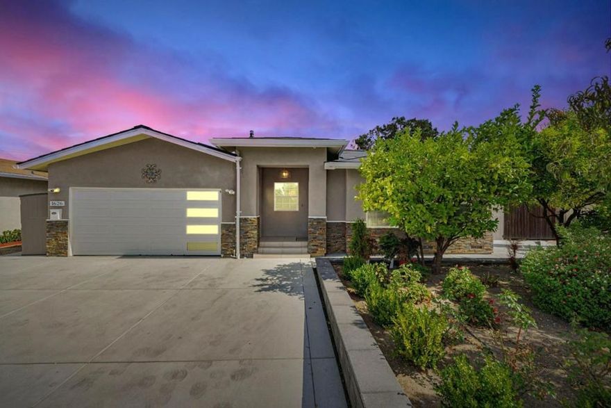 This beautiful, turnkey 4BR/3BA single level home spans approx. 1,923 sq ft and offers the perfect balance of style, comfort and convenience - giving you peace of mind with no major projects needed!  High ceilings, abundant windows and skylights fill the open room layout with natural light creating a bright, welcoming space. The home was transpired, and additional living space was created in 2019. The complete renovation introduced new:  flooring/windows throughout, a stylish kitchen with stainless mosaic tile and granite counters, spa-inspired bathrooms and HVAC system. Recently, the home has again been elevated with a Tesla Solar Roof (owned!), power wall and vehicle charging station, main panel upgrade, Indow window inserts for sound control, Samsung kitchen appliances, whole-house water softener, 3 phase water purifier, hardscaping creating usable/low maintenance space and a dry sauna to pamper yourself - making this home as luxurious as it is functional. Two ensuite bedrooms provide privacy for you and your guests. Nestled in one of the most central commute locations of Silicon Valley, you are a few-minute walk to Apple, minutes to Nvidia and access to Silicon Valley's tech corridor. Located near highly rated schools, restaurants and shopping, you will love this home!