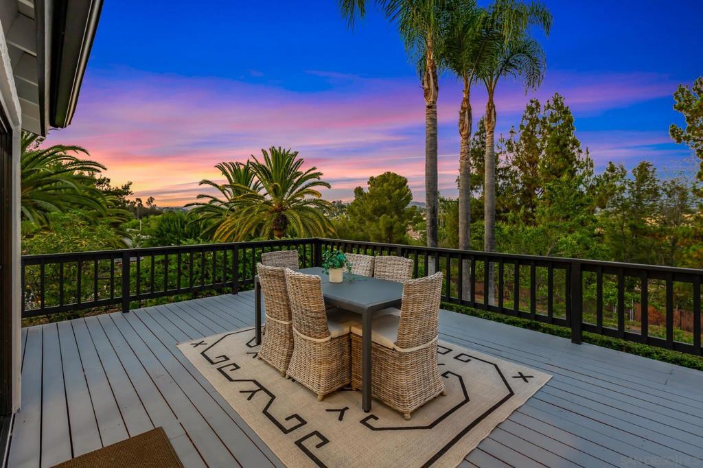 Move-in Ready & Priced to Sell! This beautifully remodeled single-story ranch sits on a peaceful Fallbrook hillside with panoramic mountain and valley views. The main home offers 3 bedrooms + office/den, 2.5 baths, real hardwood floors, a light-filled living room with fireplace, and an open-concept kitchen with quartz, high-end appliances, Jenn-Air double oven, warming drawer, and butler’s pantry. A spacious wraparound porch blends indoor-outdoor living, perfect for entertaining or quiet mornings. Enjoy your own orchard of avocado, peach, nectarine, apricot, and Meyer lemon trees. A separate two-story garage/workshop with upper-level living quarters provides incredible versatility for guests or projects. A rare opportunity combining charm, functionality, and endless views!