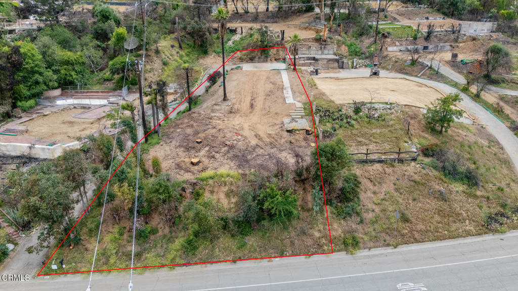 This lot offers extraordinary views of the LA basin and on a clear day, you can see to Catalina Island! The previous house was two levels with 3 beds, a den and 3 baths totaling 2224 sqr ft. Close to hiking trails and everything Altadena has to offer, this lot is very private and offers lots of possibilities. Please note that there is an additional circular flat pad at the top of the driveway to the left just as you turn and arrive at the top.