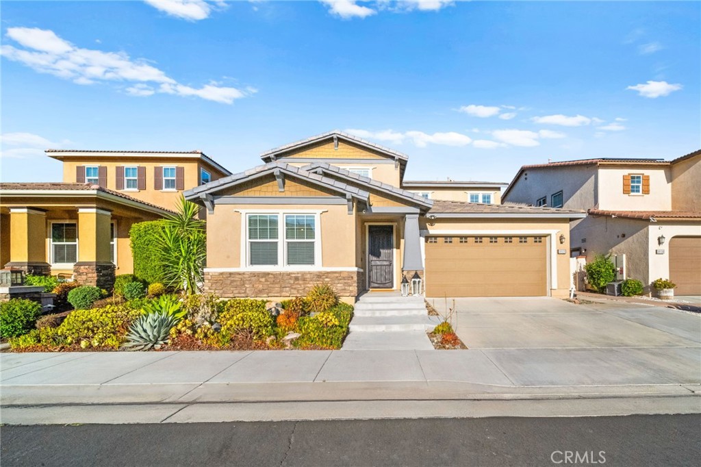 Located in the gated community of Roripaugh Ranch, this spacious 3,344 sq ft home offers 5 bedrooms and 3.5 bathrooms with a layout that checks all the boxes. Downstairs you'll find a private guest suite with en-suite bath—ideal for visitors or multi-gen living. A large bonus room is also located on the first floor and is currently used as a game room, complete with custom barn doors for privacy—perfect as a home office, playroom, or media space.
The wide open floor plan blends the kitchen, great room, informal dining, and formal dining areas, creating the perfect setting for entertaining or family gatherings. The kitchen features a large center island with seating, wrap-around granite counters, custom vinyl-wrapped appliances including a double oven, a Costco-sized pantry, and a picture window over the sink with views of the backyard.
Upstairs you’ll find three generous secondary bedrooms, including one oversized room currently used as an office—offering plenty of flexibility. A built-in tech center just outside the bedrooms is perfect for homework or remote work. The primary suite features dual walk-in closets, dual sinks, a soaking tub, separate shower, and a dedicated vanity space. Laundry is also conveniently located upstairs.
The backyard is the true highlight—designed to enjoy Temecula’s beautiful weather year-round. Relax or entertain with a private pool, spa, splash pad, BBQ, Alumawood patio cover, and an elevated seating area that feels like your own cabana retreat.
Located just one block from the clubhouse and heart of the community, residents enjoy access to country club-style amenities including a 24/7 fitness center, Olympic-size pool, tennis courts, basketball court, pickleball, two parks, and miles of paved walking trails. With a low tax rate and proximity to top-rated Temecula Valley schools, it’s easy to see why Roripaugh Ranch is one of Temecula’s most desirable communities.