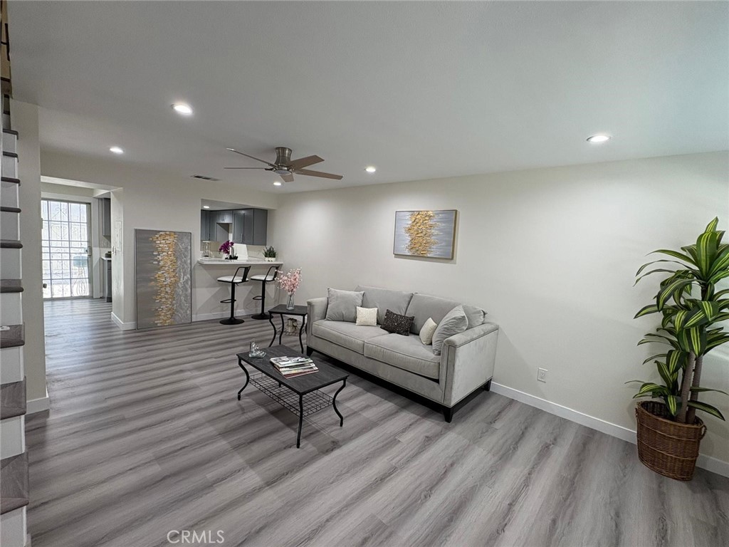 Here is your chance to own this beautifully remodeled townhouse-style condo, nestled within a secure gated community in the heart of Compton. This spacious two-bedroom, one-and-a-half-bath home features a thoughtful layout, with both bedrooms and the full bathroom located upstairs, and a convenient half bath on the entry level. Step inside to luxury wood-style vinyl flooring and recessed lighting throughout. The fully renovated kitchen boasts brand-new shaker cabinets, quartz countertops, and stainless steel appliances — including a refrigerator, stove, microwave, and dishwasher. Just off the kitchen and dining area, enjoy a private patio with a storage room, perfect for relaxing or entertaining. Upstairs, you'll find the laundry room for added convenience. This home also features a brand-new HVAC system providing central air and heat — ideal for year-round comfort. The community is beautifully maintained, with lush landscaping visible right from your front door and windows. Don’t miss your chance to fall in love with this move-in-ready gem!