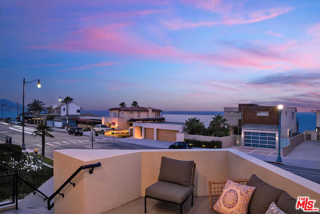 *** Please call to view by appointment only *** Tucked above the shoreline at the top of the Knob Hill staircase, this architectural coastal townhouse blends beachfront charm with refined style. Spanning nearly 1,900 square feet, this extensively renovated, newer-construction duplex is a timeless example of contemporary coastal modern- standing out along the Esplanade with bold angles, clean lines, and only 2 residences. Step inside and you'll appreciate how the tiered facade and walls of glass fill the space with natural light and sweeping views. At the heart of the home, the open-concept great room blends living, dining, and kitchen areas with white oak floors, an open-air stairwell and dramatic converging glass panels that frame panoramic views - from the coastline to Palos Verdes - and capture every sunrise and sunset! The cozy dining space, wrapped in glass, opens to a sitting deck- your front row seat to South Redondo's coastal energy and expansive views. The remodeled kitchen balances warmth and minimalism with designer appliances including a chef-grade 6-burner Bertazzoni range, quartz countertops, custom oak cabinetry and Heath Style tile-work. Just beyond the great room, a rare west-facing oversized patio offers exceptional space, privacy, and lush landscaping, a level of comfort and amenity seldom found along the Esplanade. It's complete with a fire pit, open-sky dining, built-in BBQ, and a custom deck encircling a new 8-person spa. The main level includes two en-suites, including a serene primary that opens directly to the stunning patio for a true indoor outdoor retreat. The spa-like bath showcases a custom oak dual-sink vanity and a sunlit glass-enclosed shower. Downstairs, a truly flexible family retreat features a custom Murphy bed, designer bath and laundry - ideal as a third bedroom, media room, or guest suite - with direct access to a private two-car garage with dual ChargePoint EV chargers. Set in the heart of South Redondo Beach, you're just steps from the sand, Redondo Pier, Riviera Village, local dining, boutique shops, and top-rated schools. Whether full-time or a weekend escape, this turnkey coastal sanctuary offers a rare blend of modern design, oceanfront serenity, and everyday convenience. *** This summer, no need to escape to Italy, la bella vita in spiaggia qui! Truly a must see. ***. By appointment only.