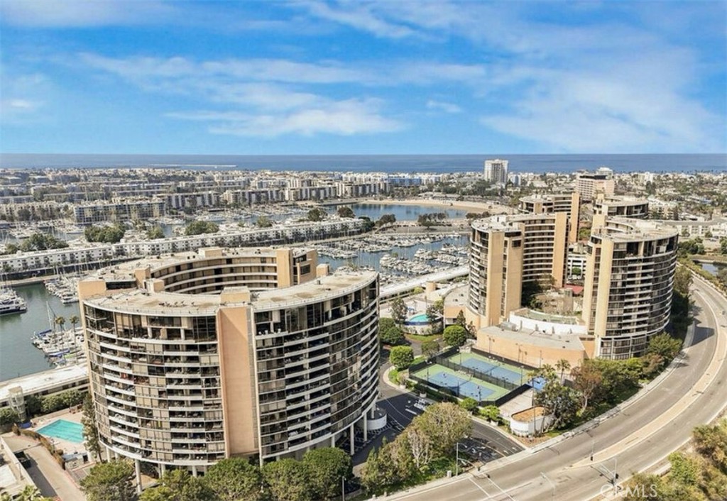 Spacious 3-bedroom, 2-bath residence in the Marina City Club offering approximately 1,722 sq ft of living space. This updated unit features an open floor plan, floor-to-ceiling windows, and a private balcony with serene views. The Marina City Club provides resort-style amenities including multiple pools, tennis courts, a fitness center, spa, restaurant, and 24-hour security. Conveniently located near the marina, beaches, shops, and dining.