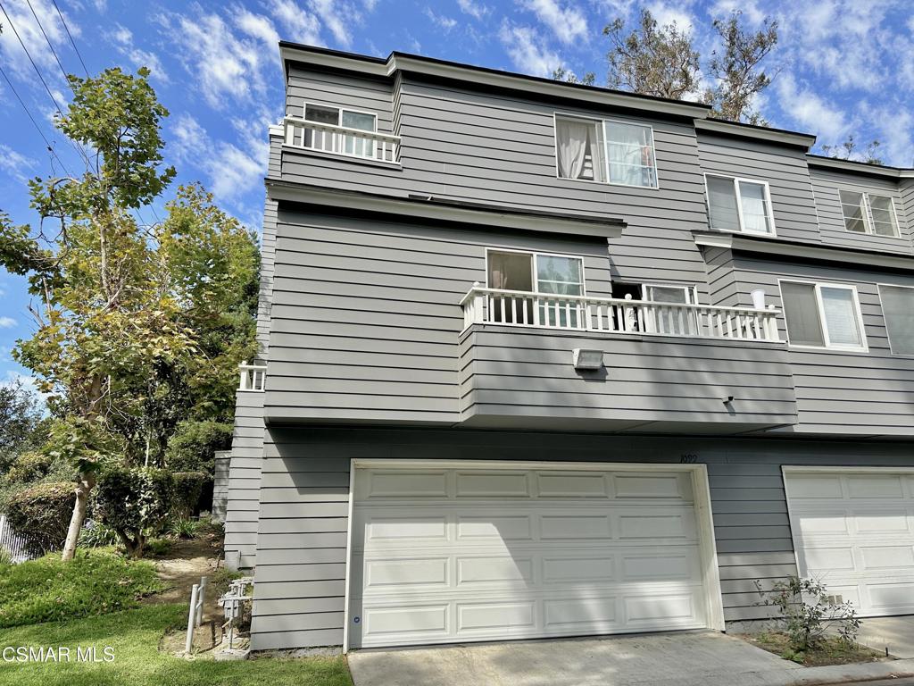Welcome to this beautiful three-bedroom, two-and-a-half-bath end-unit townhome located in the highly desirable community of The Cape. Featuring the largest floor plan in the neighborhood, this home is ideally situated at the end of the building, offering extra privacy, abundant natural light, and a spacious open layout.Upon entry, you're greeted by a bright living room with soaring ceilings, expansive windows, and a cozy fireplace. The kitchen boasts crisp white cabinets, tile countertops, a kitchen island, gas stove, and built-in microwave. Tile flooring runs throughout the downstairs, while the upstairs features wood-like floors for a warm, stylish touch.The primary suite upstairs is a true retreat, a large closet, and an en suite bathroom. Two additional bedrooms provide plenty of space for family, guests, or a home office.Enjoy two private outdoor living spaces--a balcony off the upstairs kitchen/dining area and a large patio space on the bottom near the living room--perfect for entertaining or relaxing. An attached two-car garage with direct access, laundry area, water softener, sink area and built in cabinets with plenty of storage.The Cape offers resort-style amenities including a sparkling pool, relaxing spa, and tennis courts. Ideally located off Telephone Road near Midtown Ventura, you'll enjoy quick access to shopping, dining, parks, and the 101 Freeway.This end-unit townhome combines comfort, convenience, and community in one of Ventura's most desirable locations--don't miss it