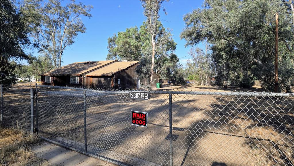 Nestled on 1.25 sprawling acres with many mature tall trees, this single-story, 2,707 SF home with 4 beds, 2.5 baths await a visionary who sees beyond cosmetic updates--an ideal canvas for a small-scale equestrian haven or multi-generational compound. ADU's are also permitted for up to two units; a one-bedroom ADU and a Jr. ADU may be permitted. While the current lot size just misses the city's 2 acre threshold for a by right horse operation, buyers can explore permit or variance routes to bring their equine dreams to life. Why does this property standout 1) Equestrian-friendly layout -- open acreage with tall, mature trees for year-round shade and room for paddocks, exercise rings, or run in shelters. 2) Rural feel with semi urban comfort with hundreds of vacant acres at the end of Shady Tree Lane to enjoy long trail rides -- enjoy the quiet of country living with public water, septic system, and two car garage. 3) Fixer-upper with upside -- at just $203 per SF, savvy buyers can add lasting value through modern updates and smart land use. Bonus amenities & lifestyle perks within Winchester's open quality with wide lanes dotted with lots of rural-style homes, yet near schools (Winchester Elementary just 1.6 mi). Commuter's advantage with easy access to 79 & 74 freeways makes daily travel to Temecula, Murrieta, and San Diego metro a breeze. Plus, recreation-rich surroundings: nearby horseback trails, apple orchards in Hemet, and outdoor parks--ideal for active families and equine lovers as Winchester is riding a wave of interest from buyers seeking rural ambiance without breaking the bank.