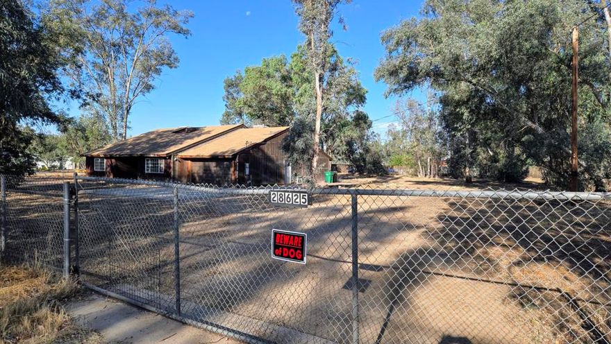 Nestled on 1.25 sprawling acres with many mature tall trees, this single-story, 2,707&#8239;SF home with 4 beds, 2.5 baths await a visionary who sees beyond cosmetic updates--an ideal canvas for a small-scale equestrian haven or multi-generational compound. ADU's are also permitted for up to two units; a one-bedroom ADU and a Jr. ADU may be permitted. While the current lot size just misses the city's 2 acre threshold for a by right horse operation, buyers can explore permit or variance routes to bring their equine dreams to life. Why does this property standout 1) Equestrian-friendly layout -- open acreage with tall, mature trees for year-round shade and room for paddocks, exercise rings, or run in shelters. 2) Rural feel with semi urban comfort with hundreds of vacant acres at the end of Shady Tree Lane to enjoy long trail rides -- enjoy the quiet of country living with public water, septic system, and two car garage. 3) Fixer-upper with upside -- at just $203 per SF, savvy buyers can add lasting value through modern updates and smart land use. Bonus amenities & lifestyle perks within Winchester's open quality with wide lanes dotted with lots of rural-style homes, yet near schools (Winchester Elementary just 1.6&#8239;mi). Commuter's advantage with easy access to 79 & 74 freeways makes daily travel to Temecula, Murrieta, and San Diego metro a breeze. Plus, recreation-rich surroundings: nearby horseback trails, apple orchards in Hemet, and outdoor parks--ideal for active families and equine lovers as Winchester is riding a wave of interest from buyers seeking rural ambiance without breaking the bank.