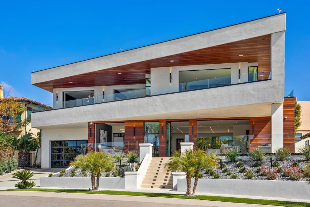 At the pinnacle of splendor and luxury, this newly constructed home is set at the highest point on Camino De La Costa offering sit down ocean views from every facing vantage point. The estate home presents an array of astounding amenities and bespoke finishes from around the world, creating ease of motion between three meticulously curated levels and an indoor/outdoor nirvana enhanced by 180-degree unobstructed views that span from Pt. Loma night lights to Windansea beach and beyond from the 2,677 square foot sky lounge with jacuzzi. No expense was spared on this home from the Italian kitchen to the honed granite fireplace to the marble kitchen counters. Find the purest form of living in this masterfully-designed, open floor plan featuring the ocean view on full display, even from the shower in the primary suite surrounded by the finest crafted Italian cabinetry you can find. Experience the apex of sophistication and modern design with museum-quality finishes throughout; why settle for anything less than the absolute best? plan featuring the ocean view on full display, even from the shower in the primary suite surrounded by the finest crafted Italian cabinetry you can find. Experience the apex of sophistication and modern design with museum-quality finishes throughout; why settle for anything less than the absolute best?