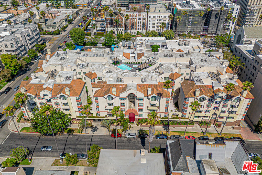 Penthouse perfection 2 bedrooms 2 bathrooms and LOFT awaits in the heart of Koreatown, where urban elegance meets resort-style living. This stunning top-floor unit offers an elevated Los Angeles lifestyle in one of the area's most desirable condominium communities. Situated in the vibrant Mid-Wilshire/Hancock Park corridor, it's just steps away from acclaimed restaurants, stylish cafes, boutique markets, and a cutting-edge movie theater while also being near Wilshire Country Club, Hancock Park, Larchmont Village, Downtown LA, The Grove, Beverly Hills, renowned schools, and public transit. The interior features two spacious bedrooms, two full bathrooms, a versatile loft, and a walk-in close tall enhanced by sleek laminate flooring, contemporary lighting, and stainless steel appliances. Residents enjoy luxurious amenities including a rooftop deck with pool and hot tub, panoramic city views, spa-style shower rooms, a fully equipped fitness center, on-site management, and guest parking. This alluring property offers a peaceful retreat tucked away from high-traffic roads, blending convenience with quiet comfort, an ideal opportunity for buyers seeking location, lifestyle, and turn-key ease, assuring a lifestyle of charm and ease. Don't miss your chance to call this exceptional urban haven home.