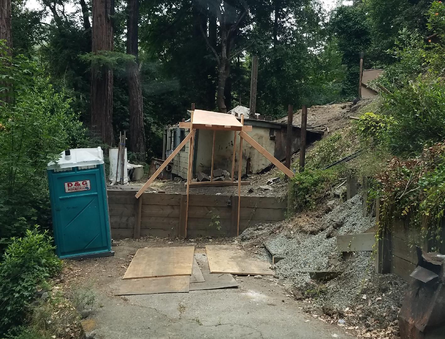 Uphill parcel with plans to build two bedroom two bath home. Original home burnt down several years ago. Some tree view. Limited parking