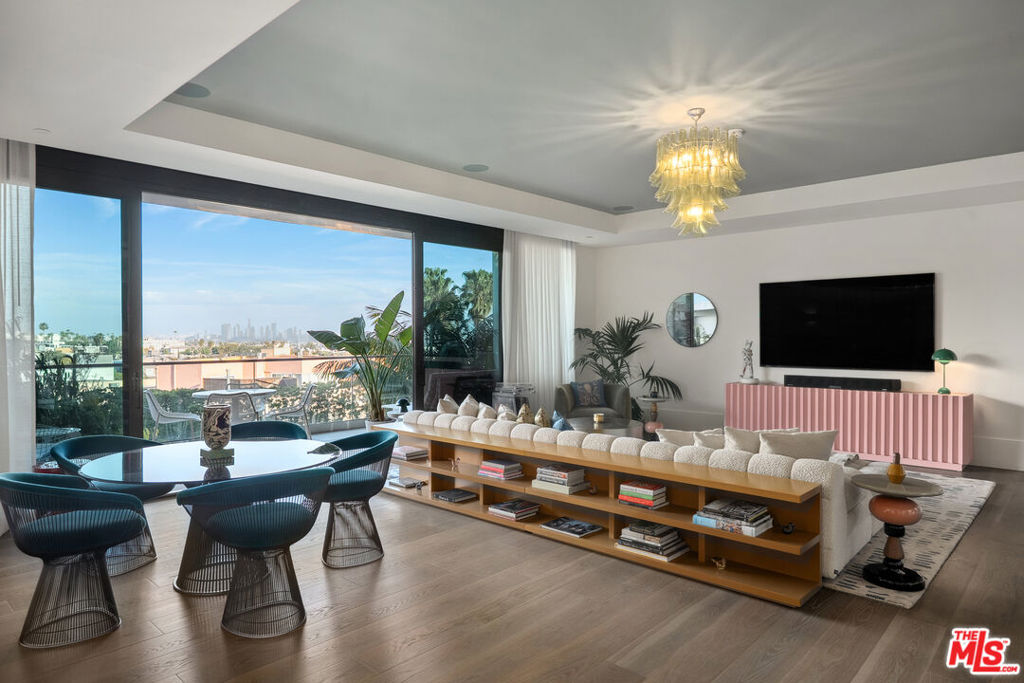 Immerse yourself in luxury at the Pendry Residences, a 24-hour full-service amenity building, located on the iconic Sunset Strip in West Hollywood. Residence 504 offers unparalleled privacy with breathtaking views that perfectly frame Downtown LA, to the iconic Sunset Tower Hotel and city skyline beyond. Sophisticated and stately, the home exudes a refined ambiance with wide-plank white oak flooring and floor-to-ceiling glass walls that bathe the space in natural light. The chef's kitchen is replete with top-of-the-line Subzero and Wolf appliances, custom white oak stained cabinetry, and Waterworks fixtures. The current owner has made significant upgrades to the residence including bookmatched Calacatta Bluette honed marble in the kitchen and entryway, custom millwork throughout, an upgraded walk-in closet in the primary suite, remodeled guest bathrooms with Calacatta Viola honed marble, Flos Skygarden recessed lights, high-end light fixtures, custom drapes/sheers, and smart home integration including 28 Definitive Technology in-ceiling speakers, Lutron lighting, Nest, and a mesh Wi-Fi system. Enjoy the convenience of direct access via a private elevator, and two parking spaces with valet parking. The Pendry Residences offers a range of unmatched residential amenities, including 24-hour concierge and security services, a rooftop pool and spa with jetliner city views, a state-of-the-art fitness center, resident lounge, a tranquil garden deck, and services of Pendry Hotel.