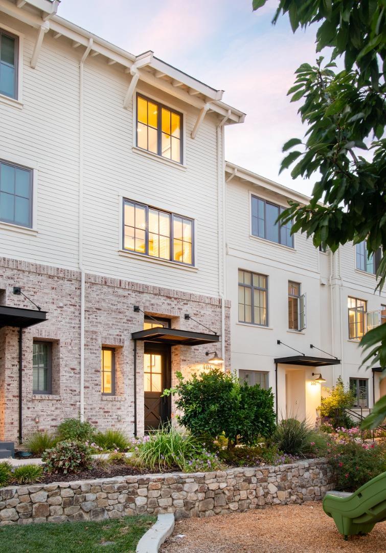 Luxurious, Modern Farmhouse-style residence in the delightful Madison community in Downtown Campbell, just a stroll away to great restaurants, shopping, award-winning festivals and the year-round Campbell Farmers Market. Built just 7 years ago by master neighborhood builder Robson Homes, this home offers a stylish sanctuary and a fantastic, walkable lifestyle. Beautiful neighborhood views! An open-concept design with high ceilings, oversized windows and hardwood floors feels warm and bright. A gourmet island kitchen boasts quartz countertops, a pantry wall, Viking appliances, plus a built-in banquette for easy dining in. Relax and unwind in a cozy living space that flows onto a covered balcony for outdoor grilling and lounging. At mid-level is a flexible-use room, ideal for working from home or additional living. Retreat upstairs to a primary bedroom suite with limestone tiled bath and large walk-in closet, plus a second ensuite and laundry down the hall. A 40' long, 2-car garage with EV pre-wire provides tons of extra storage. Ideally located next to the 10-mile Los Gatos Creek Trail and Campbell Park for morning runs, bike rides and all-day play. Enjoy easy commutes to major Silicon Valley tech giants, downtown San Jose and the International Airport. It's a gem!
