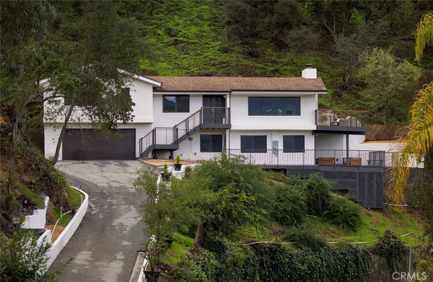 Welcome to a breathtakingly re-imagined home where modern luxury, privacy, and panoramic views come together seamlessly. Over $1,000,000 has been invested in a full renovation, including a new permitted addition, expansive deck, and a balcony with exterior stairs—every detail thoughtfully designed and fully permitted.
This residence offers complete privacy throughout, enhanced by its hillside position and natural surroundings. Nearly every room captures stunning, unobstructed views of the mountains, Pasadena skyline, and evening city lights. The living room features dramatic A-shaped vaulted ceilings, amplifying both the openness and the incredible vistas.
All major systems have been fully upgraded with permits: new electrical panel and city service line, HVAC, plumbing, tankless water heater, dual-pane tempered windows and doors, new stucco, insulation, garage door, and entirely remodeled kitchen and bathrooms with premium finishes.
Ideally located in the historic San Rafael neighborhood, perched just above the iconic Rose Bowl Stadium, this one-of-a-kind home also includes an attached two-car garage and offers up to 10 parking spots.