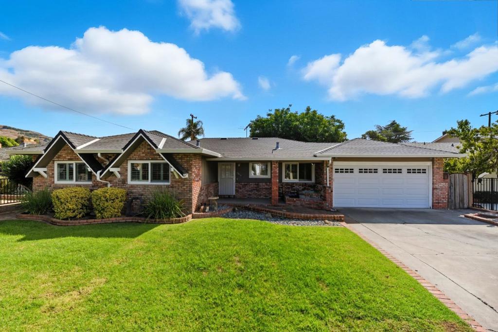 Welcome to your new home in the vibrant city of San Jose! This charming residence offers 1,702 sq ft of comfortable living space on a spacious 7,210 sq ft lot. The home features three bedrooms, including a primary bedroom on the ground floor, and two full bathrooms, one of which is updated with a stall shower, and a shower over tub. The kitchen is a chef's delight with quartz countertops, a range hood, oven range, dishwasher, garbage disposal, and a roomy pantry, perfect for all your culinary adventures. Relax in the separate family room or enjoy the cozy ambiance of the fireplace. The flooring is a combination of durable tile and other materials. For your convenience, the home includes a laundry room equipped with a washer and dryer, electricity hookup, tub, and sink. Central AC and heating ensure year-round comfort. Alarm system. Located within the Berryessa Union Elementary School District, this home is ideally situated for families. Don't miss this opportunity to make this San Jose gem your own!