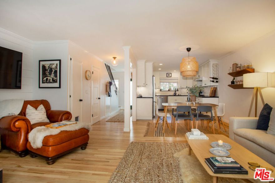 Newly remodeled 2-bedroom + 2.5-bath townhome located in the highly sought-after Windsor West, a charming Country English garden-style complex surrounded by lush rose gardens and mature foliage. This beautifully updated residence features double-paned windows, new hardwood floors, custom shutters, crown moldings, and thoughtfully selected lighting throughout. The main level offers a gourmet kitchen with custom soft-close cabinetry, top-of-the-line appliances and fixtures, a convenient powder room, cozy fireplace, and a spacious private patio, perfect for indoor-outdoor living and entertaining. Upstairs, both bedrooms feature en-suite baths. The primary bath is a standout, thoughtfully designed with modern geometric stone flooring, Italian walnut soft-close floating cabinetry, a spa-like wet room shower accented with Porcelanosa tiles, and a stunning soaking tub. Additional highlights include new mini-split A/C systems, in-unit laundry, bike storage, and convenient access to gated tandem parking with an additional storage locker. A rare opportunity to own a turnkey home in a serene yet centrally located community.