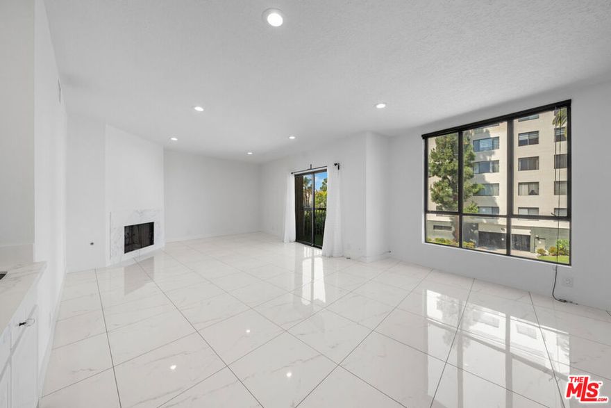Beautifully renovated and perfectly situated, this spacious 2-bedroom, 2.5-bath residence in the highly desirable Chateau Fremont offers sophisticated living in one of the city's most convenient locations. Set within an intimate 18-unit boutique building near Hancock Park, Larchmont Village, Koreatown, and Paramount Studios, this home spans approximately 1,662 sq. ft. of stylish, light-filled interiors. The expansive living room features a cozy fireplace and opens to a sunlit balcony, creating an ideal setting for both relaxation and entertaining. A dedicated dining area flows seamlessly into a bright kitchen with a charming breakfast nook. The luxurious primary suite impresses with a generous walk-in closet, a spa-like bath, dual vanities, and a spacious shower. A secondary en-suite bedroom offers the perfect retreat for guests or a home office. Additional highlights include in-unit side-by-side laundry, secure gated parking with two side-by-side spaces, and unbeatable proximity to premier shopping, dining, and entertainment. Combining comfort, elegance, and convenience, this residence is a true gem in the heart of the city.