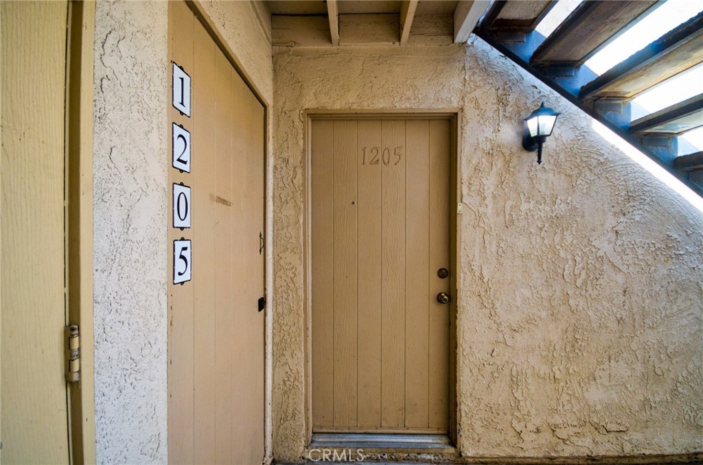 Lower level unit with 2 bedroom/ 1 Full bath. Upgraded kitchen and bath. New Laminated wooden floor installed in bedrooms. Close to parking and near pool area. Open floorplan with private patio. Spacious bedrooms with large closets and plenty of storage. Cinnamon Tree amenities include pool, spa, barbeque area, club house and laundry. Conveniently located across from the Placentia Civic Center, Police Station and Public Library. Alta Vista Country CLub, parks, schools, shopping and 57/91 freeways are all nearby.