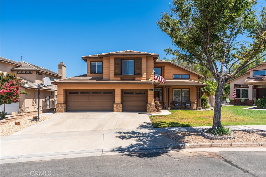 This beautiful 4 bed/4bath pool home is ready for the next generation to live and love! Maintained by the original owners, step in to a vast open living area with impressive vaulted ceilings full of windows steaming volumes of natural light, complimented by gorgeous brand new wood-look flooring throughout entire first level. The stunning staircase makes an elegant statement leading to 4 generously sized bedrooms. A grand double door entrance invites you to an oversized primary ensuite with sitting area, large soaking tub, separate walk-in shower, dual sinks and dual walk-in closets. Sliding doors lead to a lovely covered balcony overlooking the sparkling pool with mountain views! Perfect setting for morning coffee or evening cocktail. Down the open hallway overlooking the living room are 3 additional ample sized bedrooms. Jack&Jill w/dual sink bathroom and a separate mini-ensuite with walk-in closet. Saunter into the open yet dreamy kitchen with cooking island, beautiful granite countertops, lovely cherrywood colored cabinetry w/adjustable shelving (lots of storage space!), open to the large family room w/fireplace (a portion of the family room is easily converted to a 5th bedroom - just enclose one wall!). A fourth full size guest bath is conveniently located on the first level along with a generously sized laundry room complete with folding area, sink and exterior door. The 3 car garage provides plenty of storage and parking for multiple vehicles. Relax by the private pool or take a soothing soak in the jacuzzi spa while grilling up some dinner on the built-in natural gas BBQ statin in the treelined backyard.Fertile filled flower bed planters surround this private backyard secured by block wall fencing. A gated side yard is great for securing animals, outdoor equipment and more! Located on a quiet street near award wing schools, nearby shopping, parks, hills for hiking, biking and trails galore! Come to Corona, your home awaits!