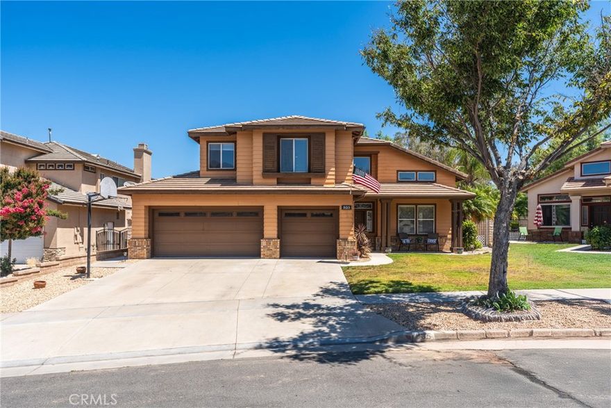 This beautiful 4 bed/4bath pool home is ready for the next generation to live and love! Maintained by the original owners, step in to a vast open living area with impressive vaulted ceilings full of windows steaming volumes of natural light, complimented by gorgeous brand new wood-look flooring throughout entire first level. The stunning staircase makes an elegant statement leading to 4 generously sized bedrooms. A grand double door entrance invites you to an oversized primary ensuite with sitting area, large soaking tub, separate walk-in shower, dual sinks and dual walk-in closets. Sliding doors lead to a lovely covered balcony overlooking the sparkling pool with mountain views! Perfect setting for morning coffee or evening cocktail. Down the open hallway overlooking the living room are 3 additional ample sized bedrooms. Jack&Jill w/dual sink bathroom and a separate mini-ensuite with walk-in closet. Saunter into the open yet dreamy kitchen with cooking island, beautiful granite countertops, lovely cherrywood colored cabinetry w/adjustable shelving (lots of storage space!), open to the large family room w/fireplace (a portion of the family room is easily converted to a 5th bedroom - just enclose one wall!). A fourth full size guest bath is conveniently located on the first level along with a generously sized laundry room complete with folding area, sink and exterior door. The 3 car garage provides plenty of storage and parking for multiple vehicles. Relax by the private pool or take a soothing soak in the jacuzzi spa while grilling up some dinner on the built-in natural gas BBQ statin in the treelined backyard.Fertile filled flower bed planters surround this private backyard secured by block wall fencing. A gated side yard is great for securing animals, outdoor equipment and more! Located on a quiet street near award wing schools, nearby shopping, parks, hills for hiking, biking and trails galore! Come to Corona, your home awaits!