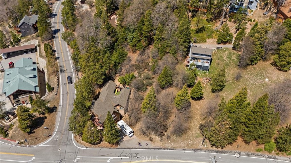 Build Your Dream Retreat in Lake Arrowhead. Discover the potential offered by this 13,280 sq. ft. vacant lot located in the scenic and highly desirable community of Lake Arrowhead. This property includes coveted lake rights, offering access to exclusive lake amenities and a serene mountain lifestyle. Just a short distance from the lake, the lot presents a unique opportunity to create your ideal mountain retreat. With utilities such as water, sewer, gas, and electricity available nearby (buyer to verify), the lot provides a blank canvas to bring your vision to life. The location may allow for stunning views of the lake and surrounding mountains, depending on your development plans. Conveniently located near the lake, recreational trails, and the charming Lake Arrowhead Village, this is a rare opportunity to build in one of Southern California’s most sought-after mountain communities.