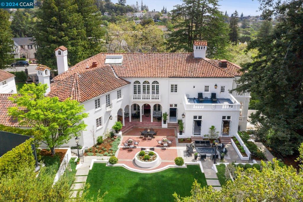 Meticulously Restored Piedmont Estate! Extraordinary opportunity to own a completely renovated and updated heritage estate in an excellent Piedmont location. Designed by notable architect Albert Farr in 1926 and known as the “Hampton House,” this property been expertly modernized while preserving the home’s elegant provenance with interiors that feature stunning natural light, custom cabinetry, marble countertops, and premium fixtures and appliances. Host gatherings in a newly renovated and expanded kitchen, impressive formal living and dining rooms and sweeping outdoor patios. A fabulous primary suite includes two full bathrooms, two full closets, sunroom, and private deck. The positioning of the house on a level, 1+ acre lot offers indoor and outdoor living with French doors facilitating effortless connection to the beautifully manicured grounds that include multiple outdoor living areas, a tennis court, a rose garden and mature hedges and trees for privacy. This extraordinary property includes a separate guest unit, full-service generator and well for landscape irrigation. A rare opportunity to enjoy all the Bay Area has to offer-live in a vibrant and walkable community of entrepreneurs, scientists, physicians, artists, and professors just minutes from San Francisco.