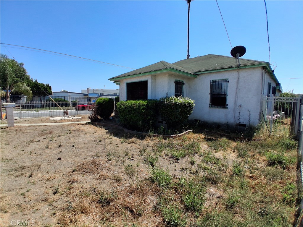 This Home is a huge corner lot, with plenty of parking space, maybe even adding adu, or converting, home is in livable condition, close to shopping center, there is a school right in front of the home, close by the freeway, yes you can live in the home now, with your imagination you can have this home with lots of potential, great for a first time buyer , or even a family that is expanding, maybe you want to convert or add an ADU , well there is plenty of space in this lot, many families like this area, due to the fact you are in the middle of DTLA and DTLB, great mid point. home dose feature tile floors in the living room, carpet in the 3 bedrooms, lots of closet space , ceiling fans , tiled bathroom, along with tiled shower, nice size kitchen, updated kitchen cabinets, tile floors in the kitchen, huge tiled dinning room, large tiled living room, nice and open space. Separate 2 car garage, large patio area with privacy, Come and look at this home, good looks, great potential, and many possibilities.