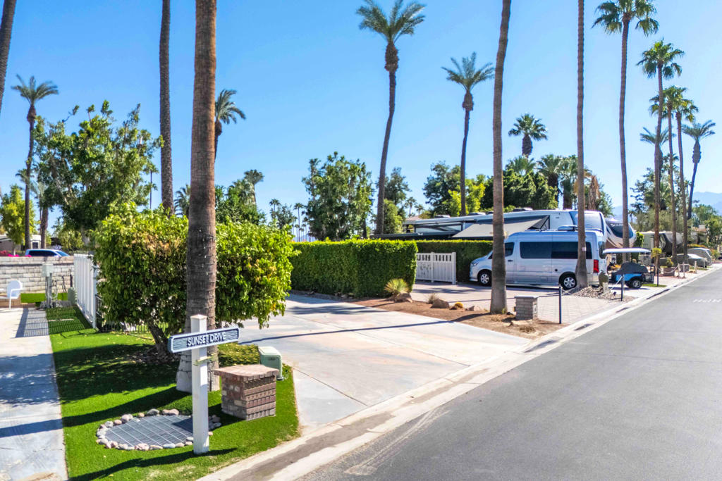 Discover the epitome of convenience and beauty with this lot near the La Palma Clubhouse and resort entry/exit. Lush fruit trees and expertly designed artificial turf accents adorn the landscape. Marvel at the stunning mountain and golf course views from the front, creating the perfect setting for your dream escape.Outdoor Resorts Palm Springs is a Five Star RV Resort Community combining luxury with affordability. It is a guard gated resort that sits on 137 beautifully landscaped acres with 27 holes of executive golf, 10 tennis courts, 13 pickleball courts, 8 swimming pools, a fully equipped fitness center, espresso bar, sports bar, beauty salon/barber shop, full-service restaurant, convenience store, 2 club houses, activities, special events and so much more.