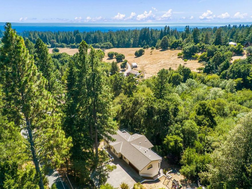 This tranquil, private retreat in lower Bonny Doon is a slice of paradise. Ideally located just minutes from North Coast beaches, Davenport, Beauregard Winery, and scenic Hwy 1 for easy access to Santa Cruz and San Francisco. Enjoy nearby hiking and biking trails and placement in the wondrful Bonny Doon Elementary school. The sun-drenched 1.36-acre parcel features spacious, fenced gardens perfect for gardening enthusiasts with raised beds, fruit trees, and room to expand. Inside, the custom floor plan offers great separation of space with an open-concept great room, a well-appointed kitchen, and balconies overlooking adjacent pastureland and coastal horizons. The 440 sq ft unfinished "man cave" on the ground floor is ideal for tools, toys, or creative space. Multiple heating and A/C zones ensure year-round comfort. Wildlife, sunsets, and serenity await. Combining natural beauty with modern convenience, this home offers a picturesque lifestyle in the sought-after Santa Cruz Mountains. Appraised at $1.3M in 2021 don't miss your chance to make it yours!
