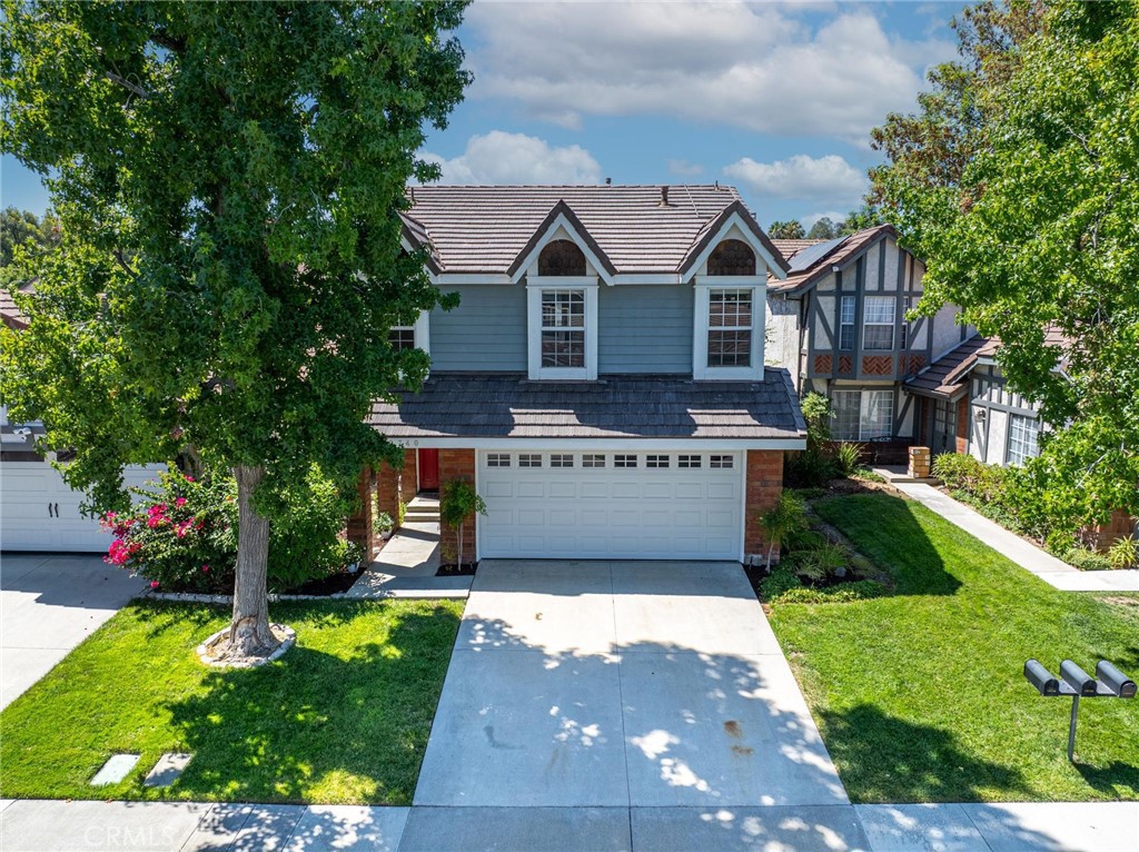 Looking for superb value? This updated home in American Beauty Classics is the one! Major upgrades within the last two years that will immediately save you money and keep you cool all summer, including Tesla Solar (WILL BE FULLY PAID AT CLOSING) and 2 PowerWall battery backups which cover your electricity use (current owners’ power bill is about $20/month), and can function off-grid or backup your home! This home also has a newer roof, newer A/C and furnace, improved ducting, and a beautiful kitchen remodel with appliances, shaker cabinets, counters and island with outlets. Copper re-pipe in 2019 and kitchen reserve osmosis water filtration tap built in.
Newer sliding door and windows! Newer flooring and lighting throughout the downstairs and bedrooms, and insulation and attic fan (making this one of the most energy efficient homes in Santa Clarita). Two remodeled bathrooms with whisper fans and humidity sensors. Newer electric fireplace and in-wall TV hookup for your game system or media player. Newer luxury garage door with windows to match this home’s classic exterior, with plenty of garage storage inside for bins and boxes. EV charger hookup!
Upgraded to integrate seamlessly with any smart home, this home has features you can access remotely (Did I remember to close the garage door?), including sprinklers and drip system irrigation via your phone, or on any schedule you set. The backyard is ideal for the home gardener, with 5 organic raised beds and citrus trees that produce an abundance of fresh fruit, vegetables and flowers for the current owners, and will stay with the property, and a newer French drain system. Patio cover and BBQ area are ready for entertaining.
With no Mello Roos and lower HOA dues, this stunning tree-lined neighborhood also offers an abundance of amenities, including front yard landscaping, four separate pool/spa areas, tennis courts, basketball court, private park & playground as well as 24/7 private security patrol! This home may be the greatest value in the Valley, come take a look while available!